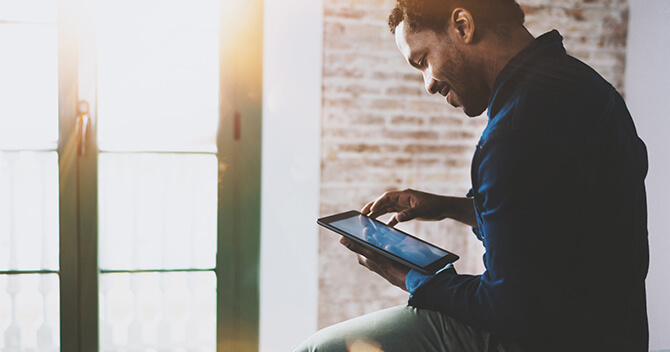 Man looking at tablet
